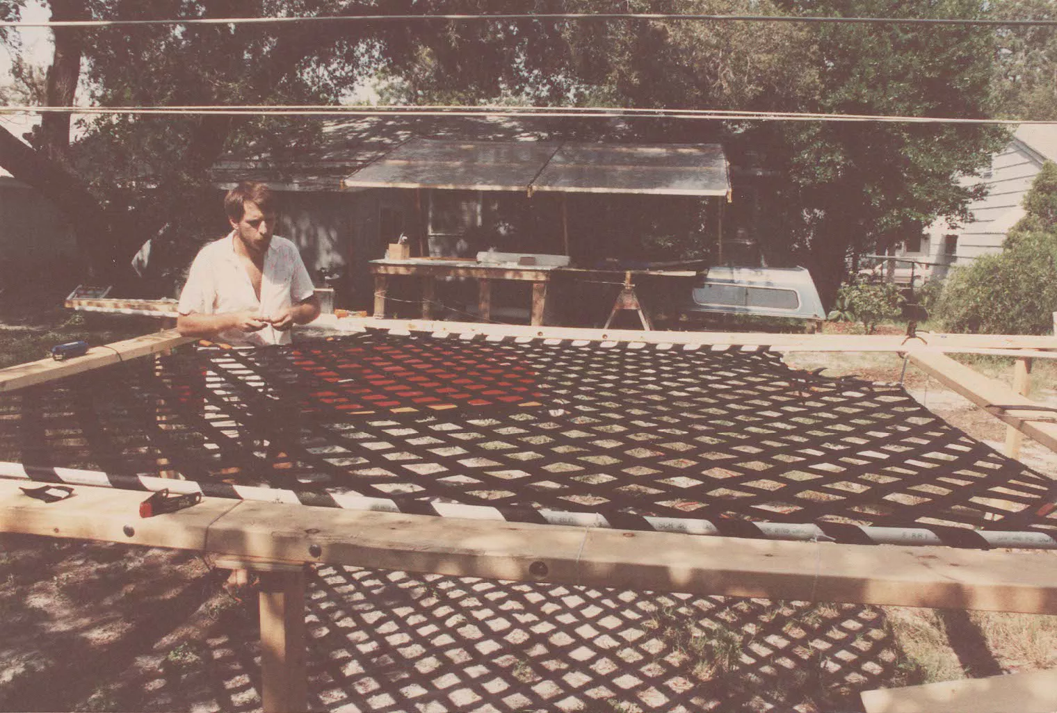 Richard in is back yard with a webbing net