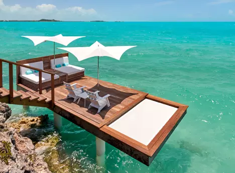 Over water deck with a tensioned net hammock built into the side