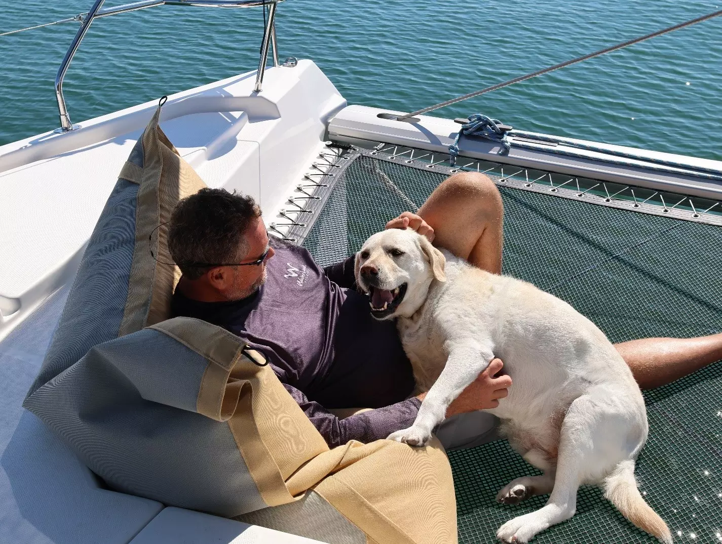 Picture of a happy man and dog on a sailors pillow