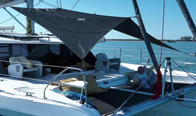 Picture of a Sunrise SHADE and Sailor's Pillow enjoyed on a catamaran.