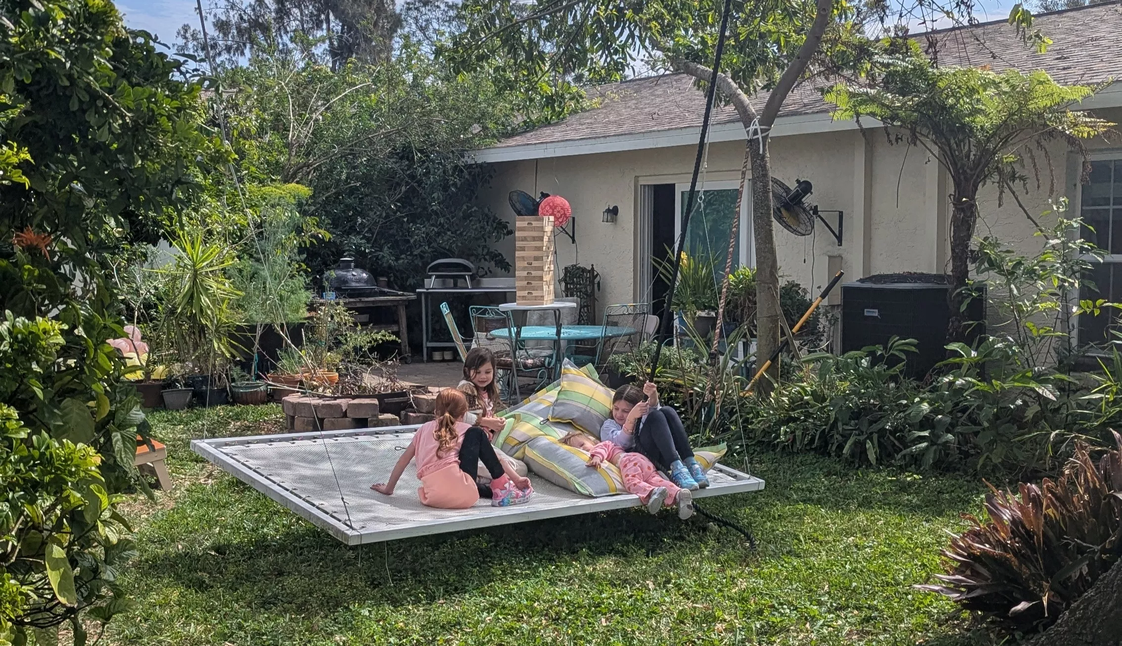 Floating BreezeBed with Square Hole Mesh, Suspended from Tree, a favorite place for kids to enjoy the backyard!